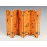 A miniature Chinese six fold table screen, early 20th century, with carved and painted decoration of