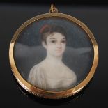 A 19th century portrait miniature, depicting half length portrait of a young girl painted on