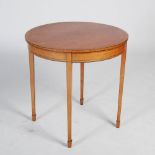 An Edwardian satinwood and ebony lined occasional table, the circular top above a plain frieze,