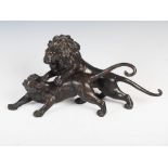 A Japanese bronze figure group of lion and tiger, Meiji Period, signed, 44cm wide x 21cm high.