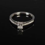 ANTWERP DIAMONDS, A platinum single stone diamond ring set with diamond cut shoulders, centred