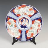 A Japanese Imari porcelain charger, late 19th/early 20th century, decorated with central roundel