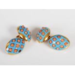 A pair of late 19th/early 20th century yellow metal, enamel and coral set cuff links, the oval domed