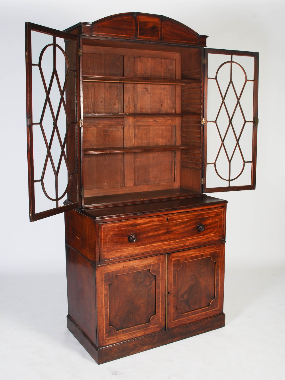 A George III mahogany and boxwood lined secretaire bookcase, the arched cornice centred with a - Image 5 of 9