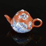 A miniature Chinese Yixing teapot cover, Qing Dynasty, decorated with blue and white enamelled