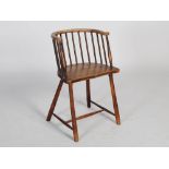 A 19th century country made ash and beech wood comb back chair, the horseshoe shaped top rail