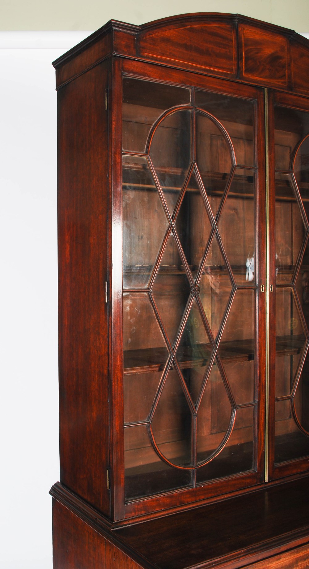 A George III mahogany and boxwood lined secretaire bookcase, the arched cornice centred with a - Image 2 of 9
