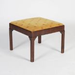 A George III mahogany square shaped stool, the later upholstered drop in seat on a plain frame,