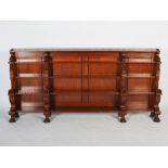 A late 19th century mahogany and ebony lined Egyptian Revival open bookcase, the rectangular top