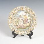 An Italian Castelli Maiolica dish, 17th/ 18th century, decorated with a boar hunt, 23cm diameter.