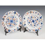 A pair of Chinese porcelain Imari circular dishes, Qing Dynasty, decorated with peony and