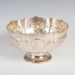 A Chinese white metal footed bowl, late 19th/early 20th century, with embossed decoration of