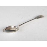 A Victorian silver serving spoon, London 1859, makers mark of GW, fiddle pattern with chased shell