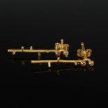 A pair of 18 carat yellow gold, diamond and pink sapphire textured twig earrings, Stamped: BA, 750