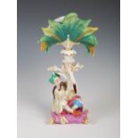 A 19th century Paris porcelain Chinoiserie Mandarin figure spill vase, the detachable upper