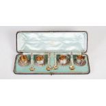 A cased set of four silver and silver gilt Victorian silver salts of nautical theme, London 1884,