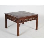 A Chinese dark wood square shaped low table, late 19th/early 20th century, the panelled