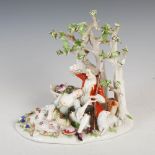 A late 19th/early 20th century Meissen porcelain figure group of shepherd and shepherdess,