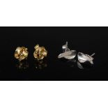 Two pairs of 9 carat gold earrings, comprising: a pair of 9 carat white gold curled cone-shaped