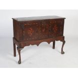 An Arts & Crafts oak and marquetry inlaid cabinet on stand, the cabinet section with rectangular top
