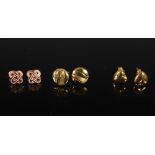 Three pairs of 9 carat gold earrings, comprising: a pair of 9 carat yellow gold pierced circular