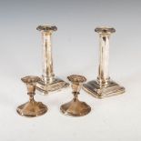 A pair of George V silver candlesticks, Sheffield 1913, makers mark of M.H. & Co. Ld., of