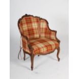 A late 19th century Louis XVI style carved walnut fauteuil, with tartan upholstered panelled back