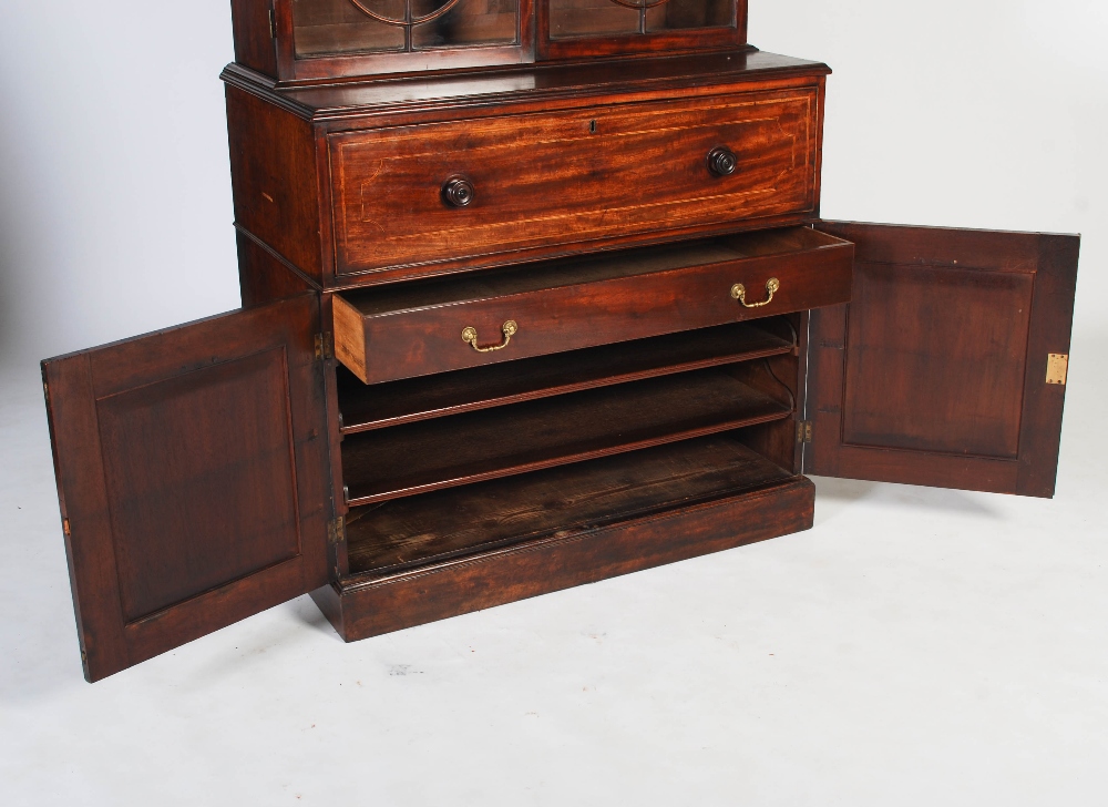 A George III mahogany and boxwood lined secretaire bookcase, the arched cornice centred with a - Image 6 of 9