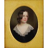 A leather cased portrait miniature of a young girl, probably painted on ivory, within gilt metal
