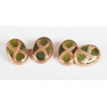 A pair of late 19th century yellow metal and green agate set cuff links, the oval panels set with