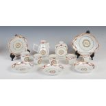 A Chinese porcelain famille rose armorial part tea set, Qing Dynasty, comprising five tea cups,