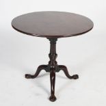 A George III mahogany snap top bird cage occasional table, the hinged circular top with bird cage