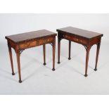 A pair of George III mahogany card tables, the hinged rectangular tops with oval and foliate