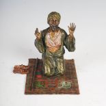Franz Bergman - A cold painted Austrian bronze figure of a kneeling Arab praying on colourful