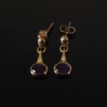 PRISM DESIGN, A pair of 9 carat yellow gold faceted oval amethyst drop earrings, Stamped: PD, 375