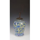 A Chinese porcelain blue and white dragon jar converted to a table lamp, Qing Dynasty, decorated