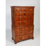 An 18th century walnut chest on chest, the moulded cornice above three short and three long