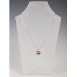 STUART GELNER, A 9 carat white gold, amethyst and diamond pendant, set with a rectangular cushion,