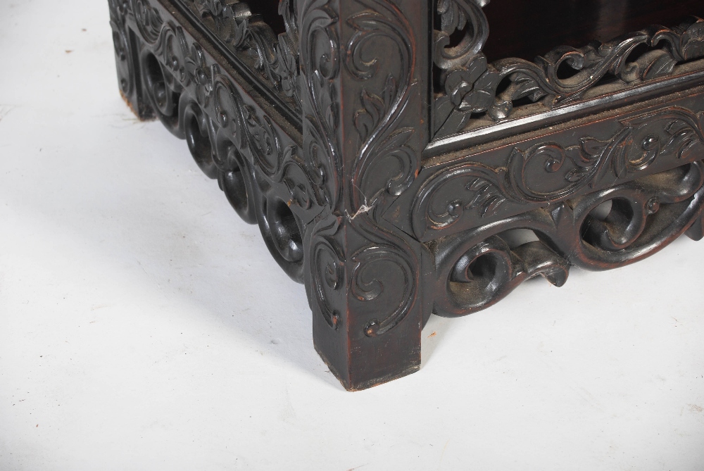 A Chinese dark wood display cabinet, late Qing Dynasty, the rectangular panelled top with a - Image 4 of 8
