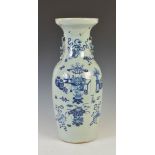 A Chinese porcelain blue and white vase, Qing Dynasty, decorated with vases issuing flowers and