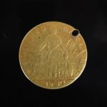 A 19th century Republica De Chile gold ten Pesos coin dated 1853, drilled, 14.7 grams.