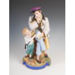 A late 19th century French Bisque porcelain figure group of teacher and boy, naturalistically