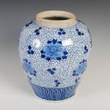 A Chinese porcelain blue and white jar, Qing Dynasty, decorated with peony on a foliate scroll