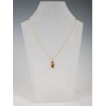 MISTRAL DESIGN, A 9 carat yellow gold pendant, set with a faceted pointed oval citrine, on 9 carat