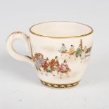 A Japanese Satsuma pottery coffee cup, Meiji Period, decorated with a procession of figures in the