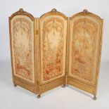 A 19th century French gilt wood and needlework embroidered three fold screen, the rectangular shaped