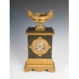 A 19th century gilt metal Regency style mantel clock, the circular engine turned dial with Roman