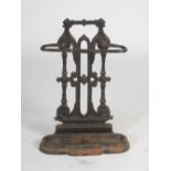 A late Victorian cast iron stick stand, cast with foliate and scroll details, with detachable drip