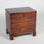 A George III style mahogany dwarf chest, the rectangular top with moulded edge above two short and