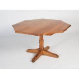 Beaverman - A carved oak octagonal shaped pedestal table, the adzed octagonal top raised on a shaped